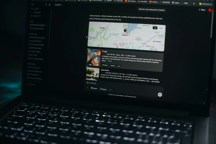 Laptop screen shows a map and related information.